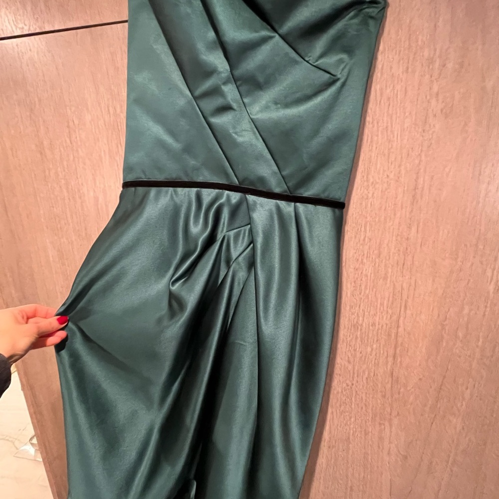 Stunning designer dress perfect for holidays or black tie event .